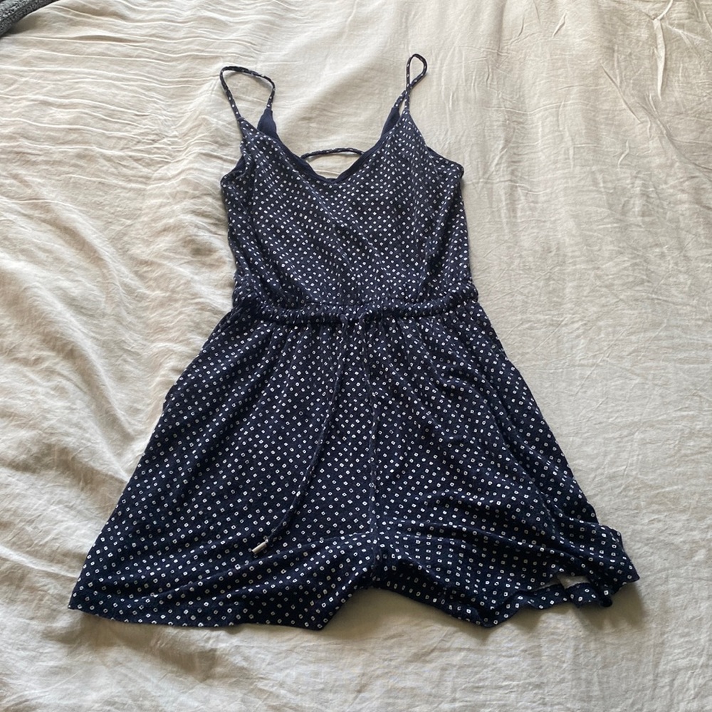 Romper with polka dot design on it in size extra small